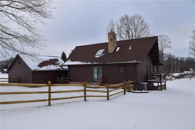 view of snow covered house