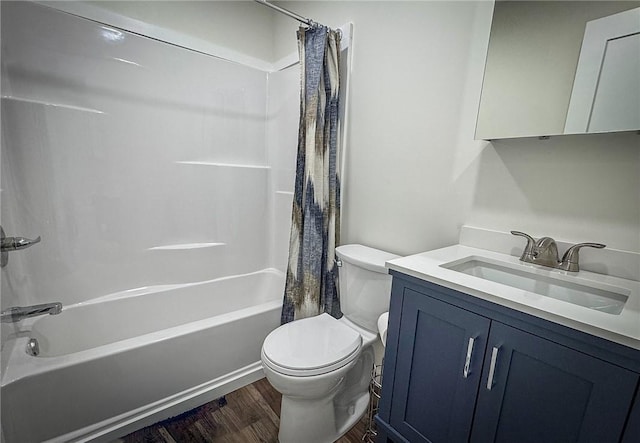 full bathroom featuring toilet, wood-type flooring, vanity, and shower / tub combo with curtain