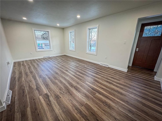 interior space with dark hardwood / wood-style floors