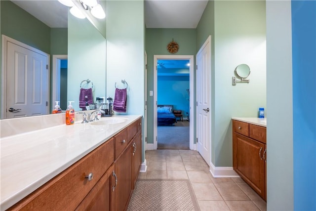 bathroom with tile patterned flooring and vanity