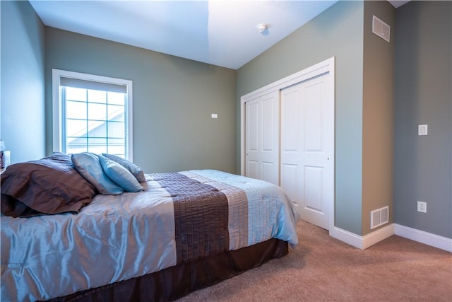 bedroom with carpet floors and a closet