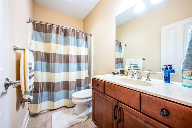 bathroom featuring tile patterned floors, vanity, and toilet