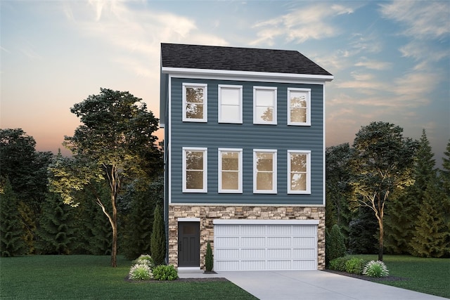 view of front facade with a garage and a lawn