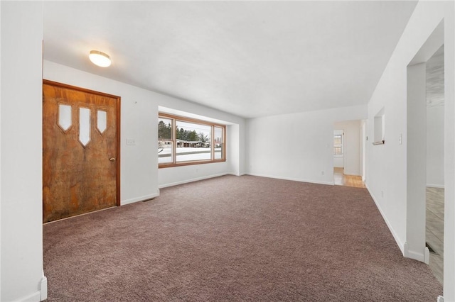 entrance foyer featuring carpet flooring