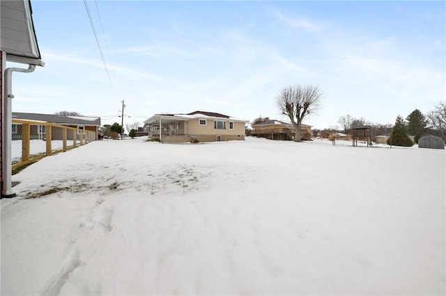 view of yard covered in snow