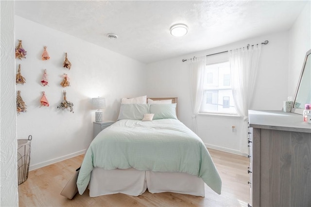 bedroom featuring light hardwood / wood-style floors