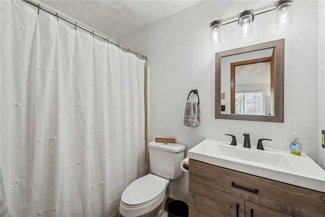 bathroom with toilet and vanity