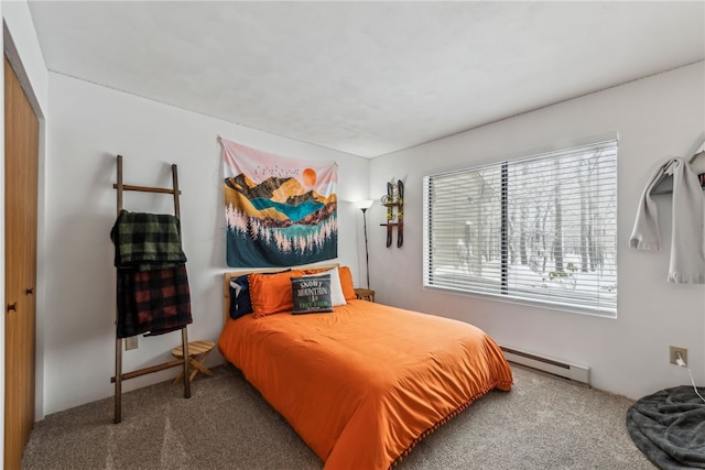 bedroom featuring carpet, baseboard heating, and a closet