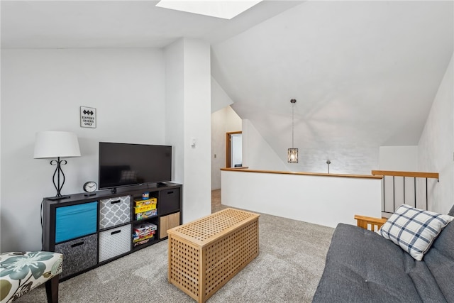 carpeted living room featuring lofted ceiling with skylight