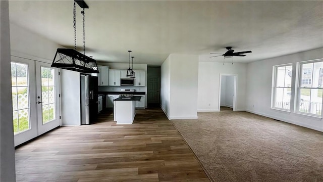 491 Shannon Dr, Mount Pleasant Twp Wml, PA 15666 - kitchen with open floor plan, dark countertops, decorative light fixtures, and a center island
