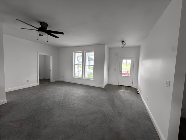 491 Shannon Dr, Mount Pleasant Twp Wml, PA 15666 - empty room featuring dark colored carpet and a ceiling fan