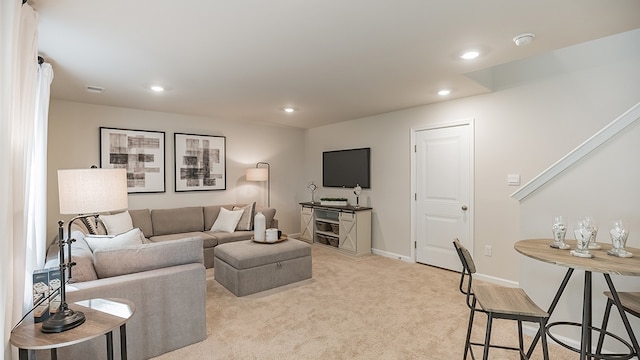 living room featuring light colored carpet