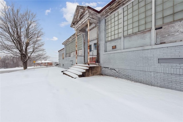 view of snow covered property