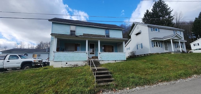 view of front facade featuring a front lawn and covered porch