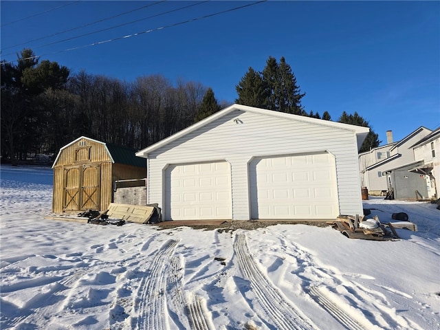 view of snow covered garage