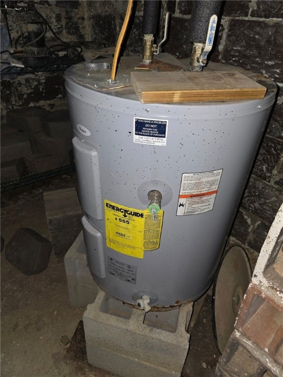 utility room featuring electric water heater