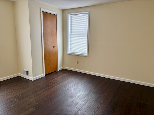 empty room featuring dark hardwood / wood-style floors