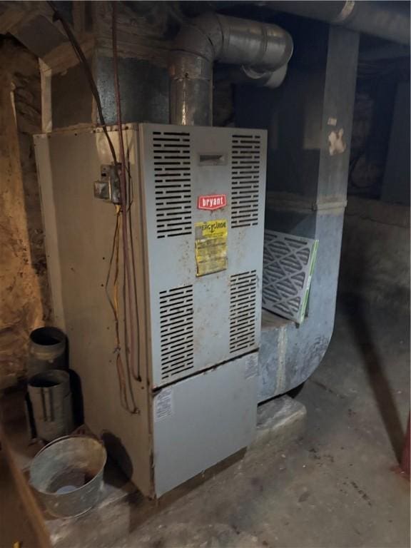 utility room featuring heating unit