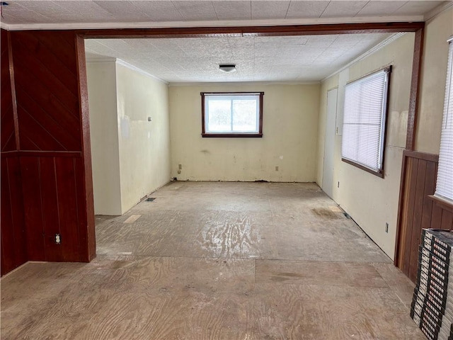 spare room with crown molding