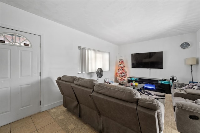 living room with light tile patterned floors and a wealth of natural light