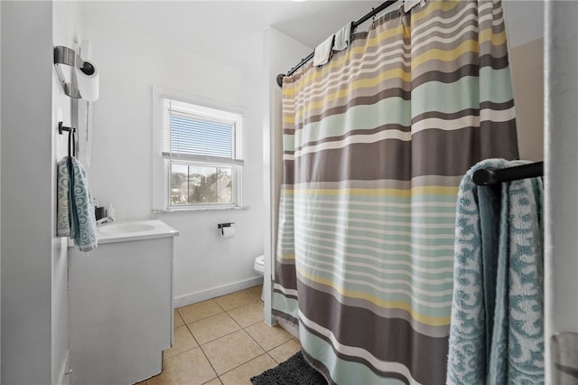 bathroom with toilet, vanity, a shower with curtain, and tile patterned floors