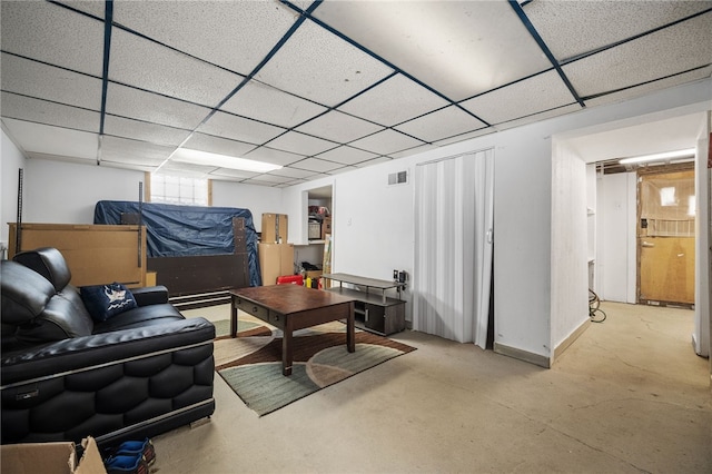 living room with a paneled ceiling