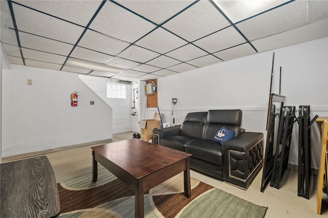 living room with a paneled ceiling