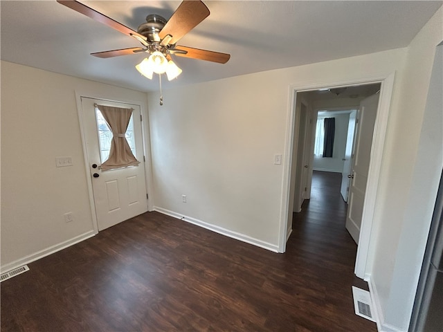 entrance foyer with ceiling fan and dark hardwood / wood-style flooring