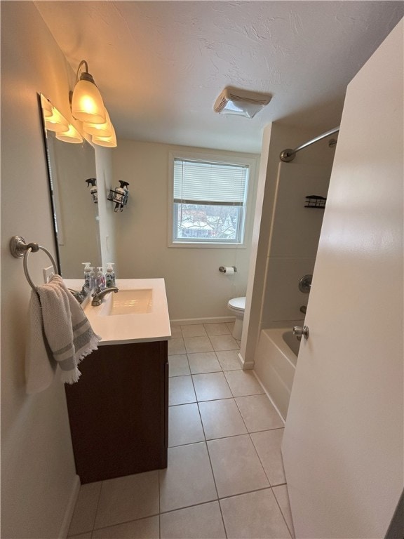 full bathroom with shower / bath combination, tile patterned floors, vanity, and toilet