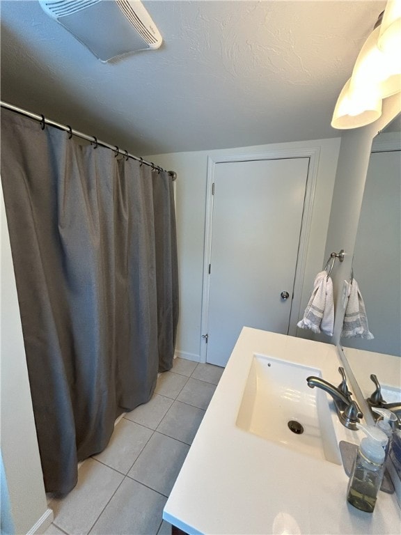 bathroom featuring tile patterned floors and vanity