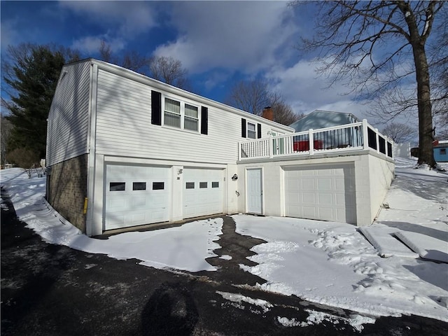 view of front of property featuring a balcony and a garage