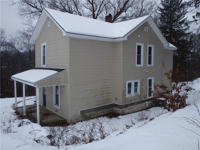 view of snow covered property