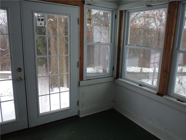 unfurnished sunroom featuring french doors