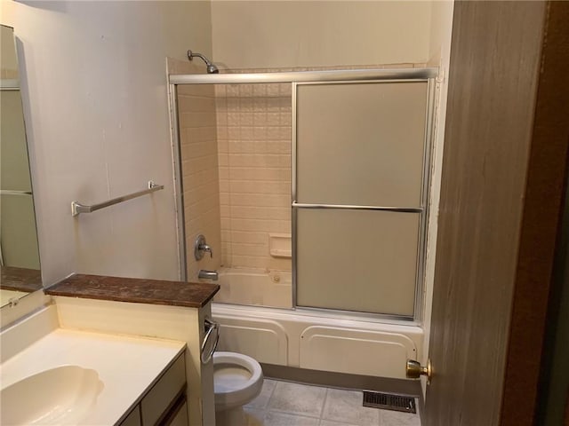 full bathroom with toilet, enclosed tub / shower combo, and vanity