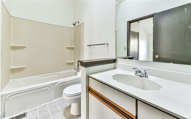 full bathroom featuring washtub / shower combination, toilet, and vanity