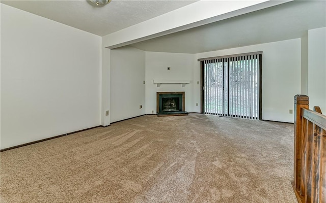 unfurnished living room featuring light colored carpet