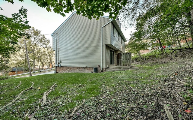 view of home's exterior featuring a lawn