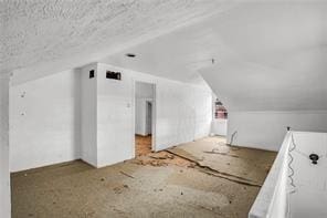 bonus room featuring lofted ceiling