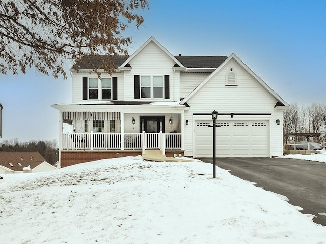 view of front of property featuring a garage and a porch