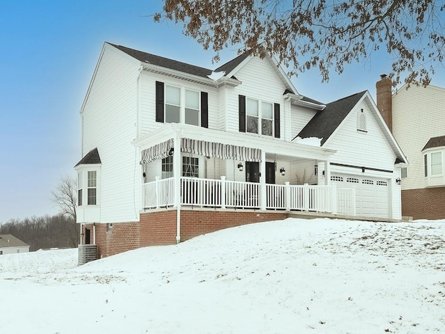 view of front of home with a garage and a porch