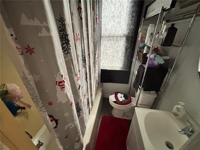 full bathroom with shower / bath combination with curtain, toilet, and sink