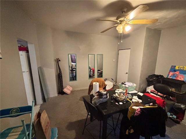 dining area featuring carpet flooring and ceiling fan