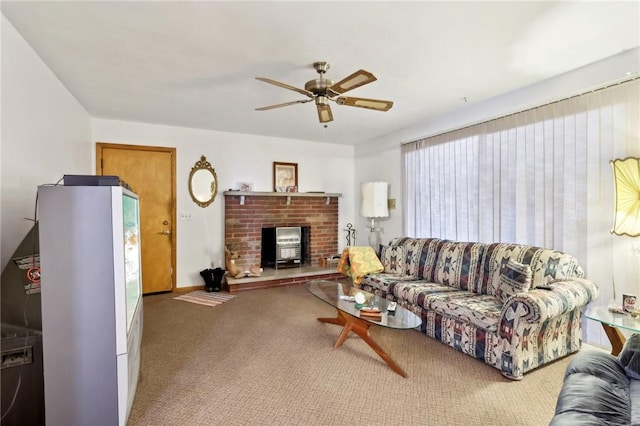 living room featuring a fireplace, a wealth of natural light, ceiling fan, and carpet flooring