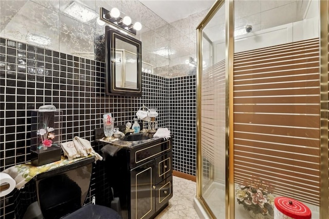 bathroom featuring vanity, tile walls, and an enclosed shower