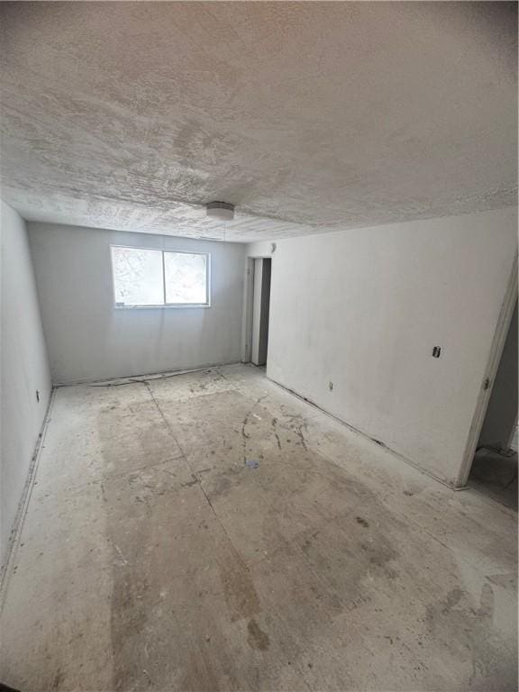 basement with a textured ceiling