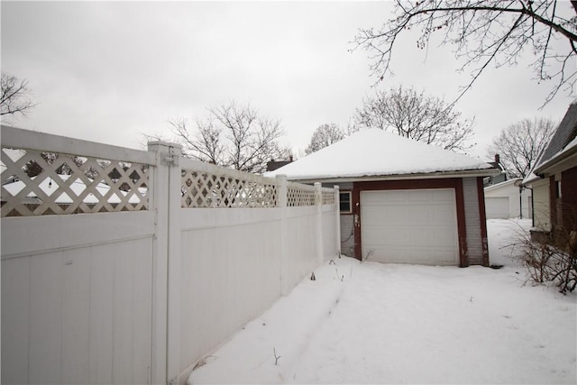 view of snow covered garage