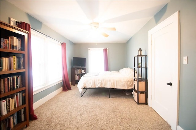 carpeted bedroom with ceiling fan