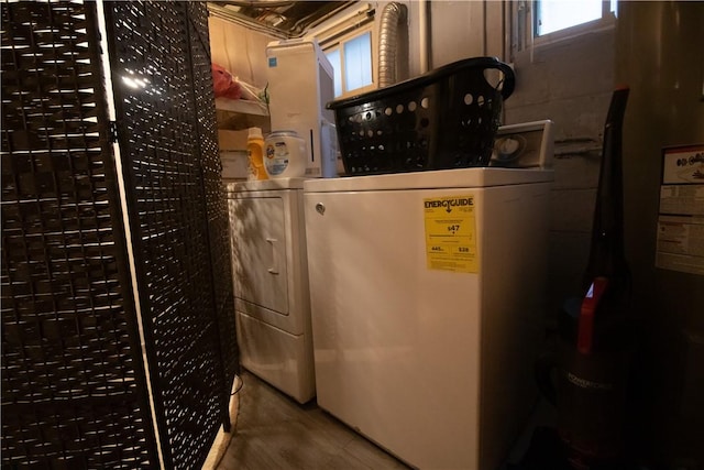 clothes washing area with independent washer and dryer