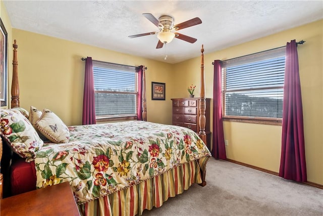 bedroom featuring ceiling fan and light colored carpet