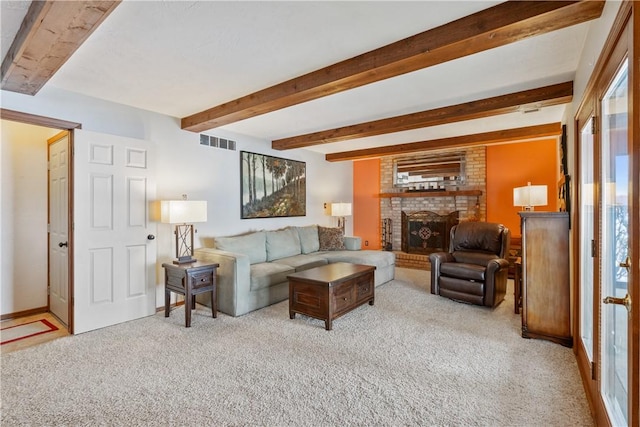 living room featuring light carpet, a brick fireplace, and beam ceiling